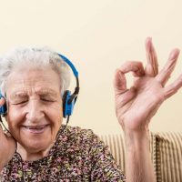 Senior with headphones