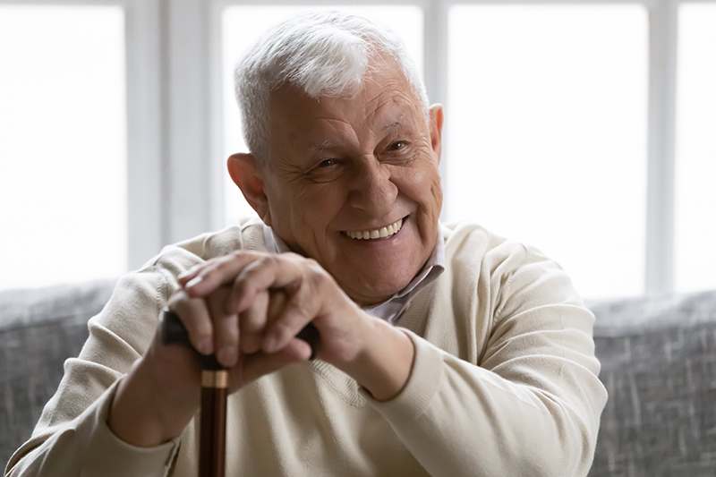 https://www.athomeindependentliving.com/wp-content/uploads/2021/06/happy-senior-man-holding-cane.jpg