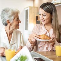 caregiver-assisting-with-seniors-daily-routine