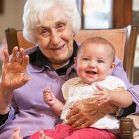 grandparent-holding-grandchild-elderspeak