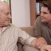 adult-son-talking-to-senior-father-with-dementia