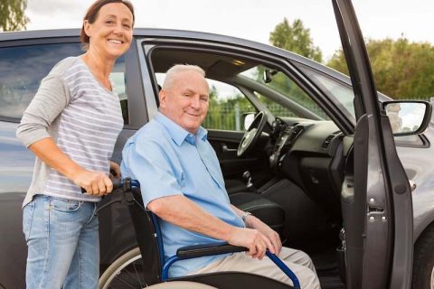 A caregiver provides reliable senior transportation in the Syracuse area for an elderly client.