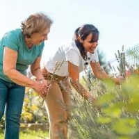 A woman who knows how to make life fulfilling after retirement enjoys an afternoon of gardening with her daughter.